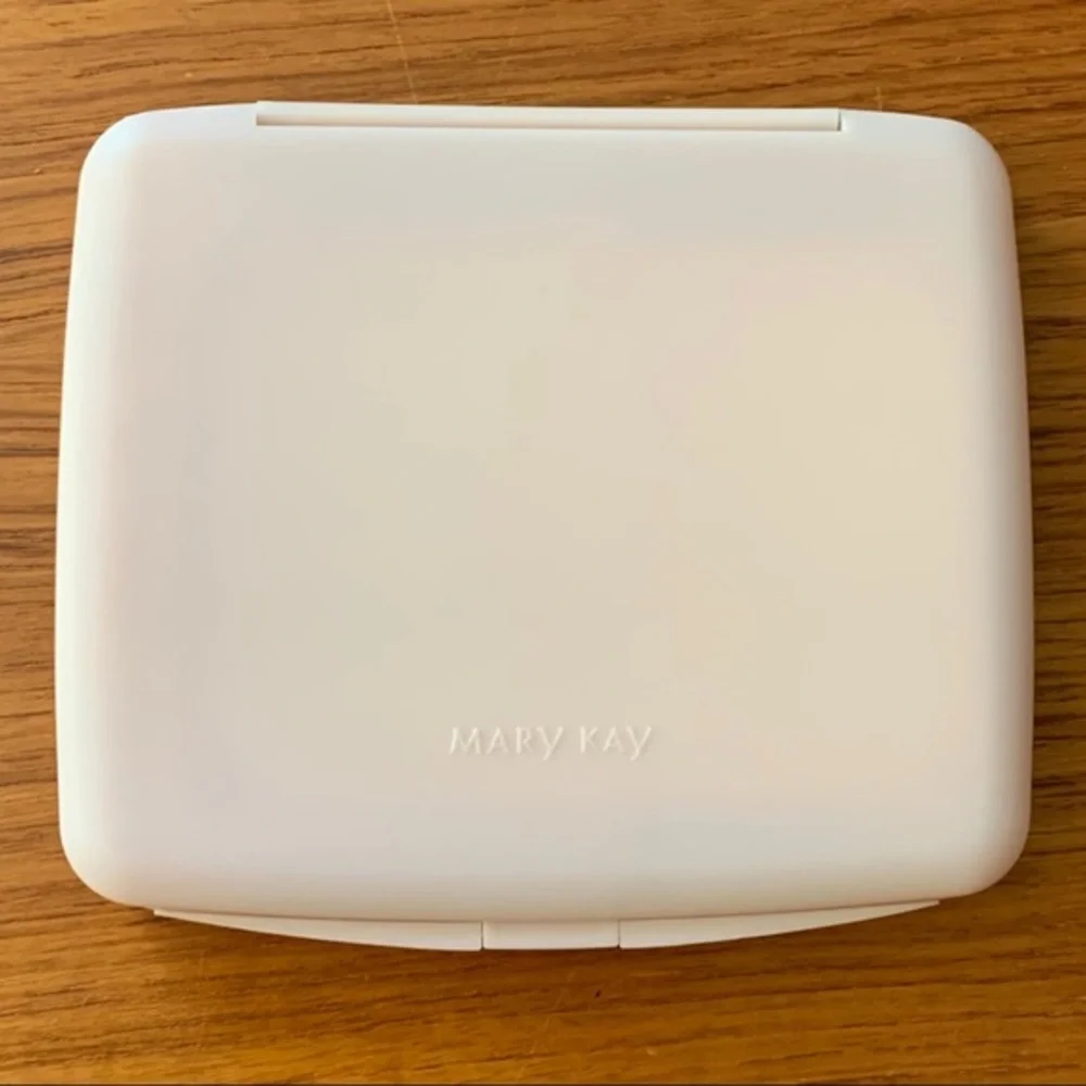 Mary Kay pink plastic compact travel mirror.